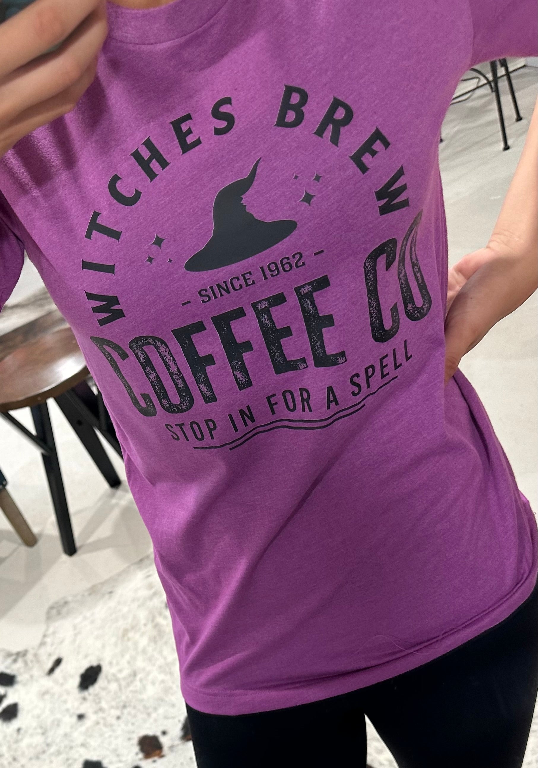 Witches Brew Coffee Tee with Halloween design, printed on Heather Magenta and Heather Autumn Bella + Canvas fabric.