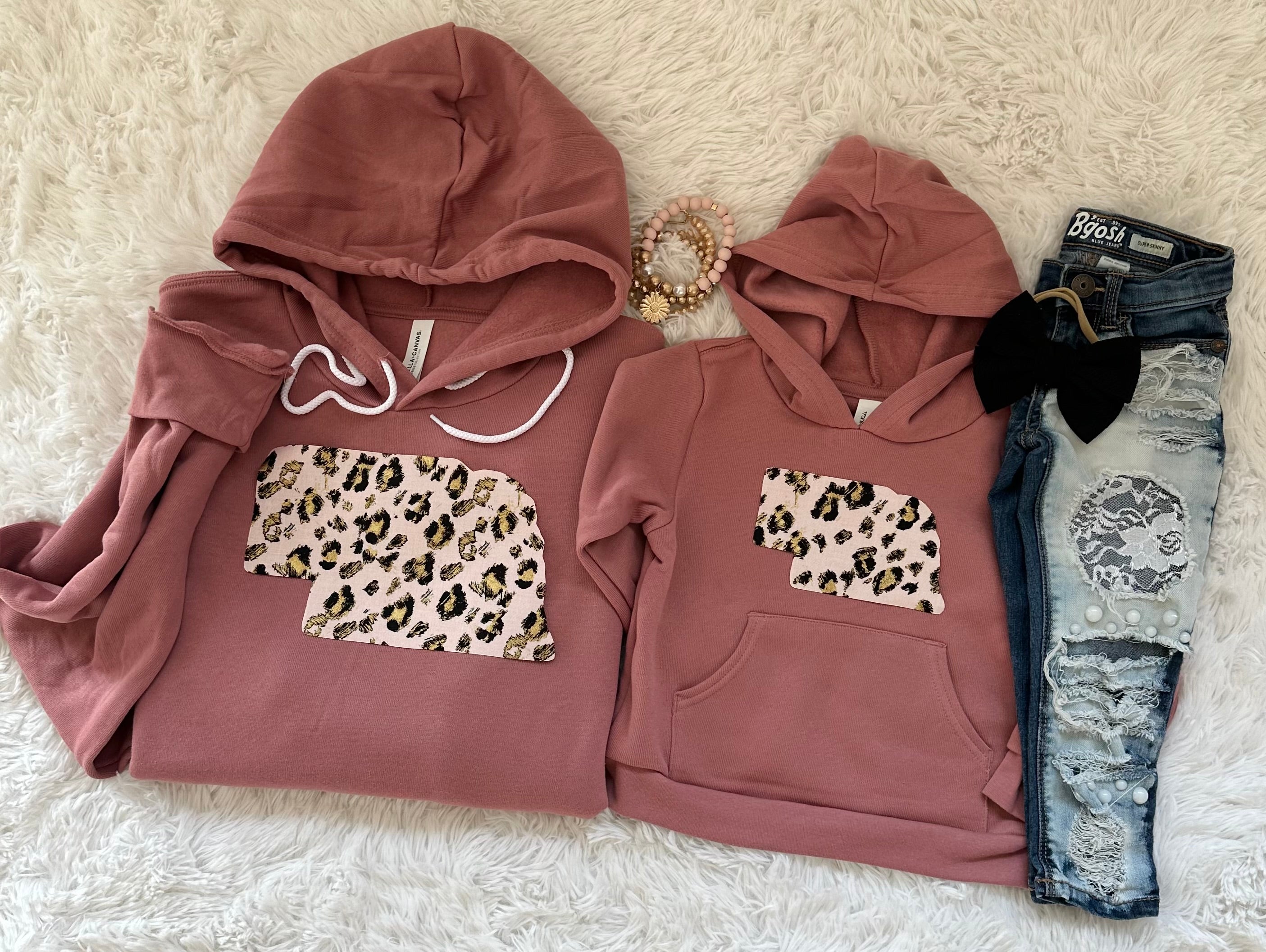 Pink Leopard State Mauve Hoodie featuring a unique hand-sewn state fabric design on premium Bella + Canvas unisex fit sweatshirts.