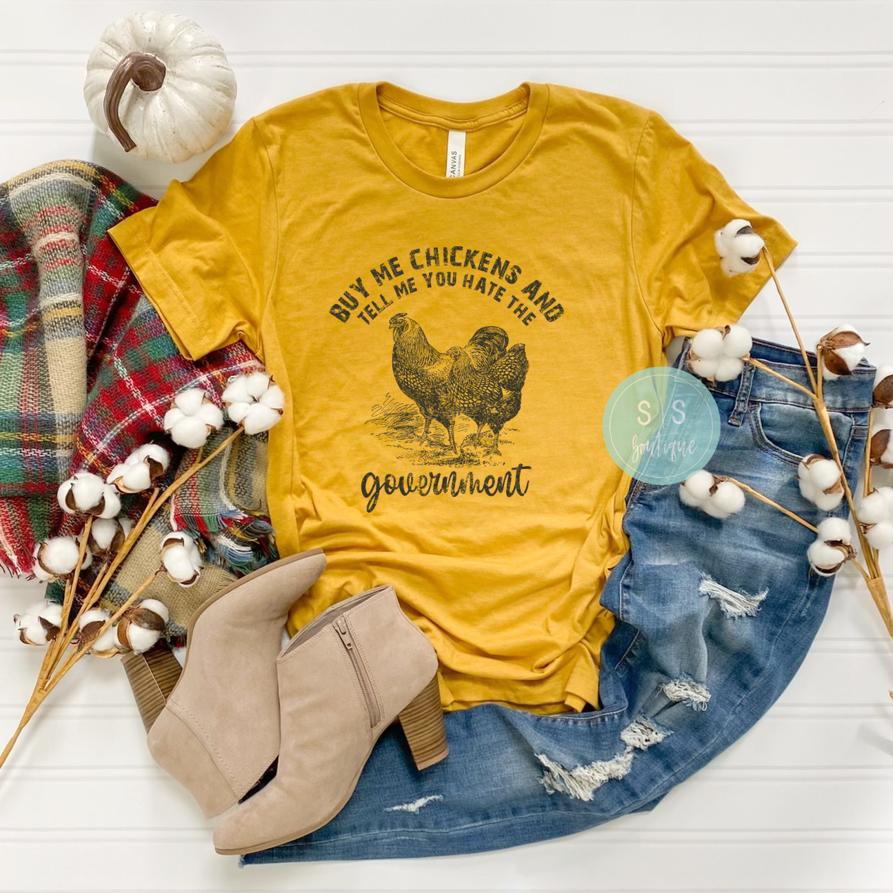 Chickens + Government Tee with bold design, printed on Bella + Canvas fabric.