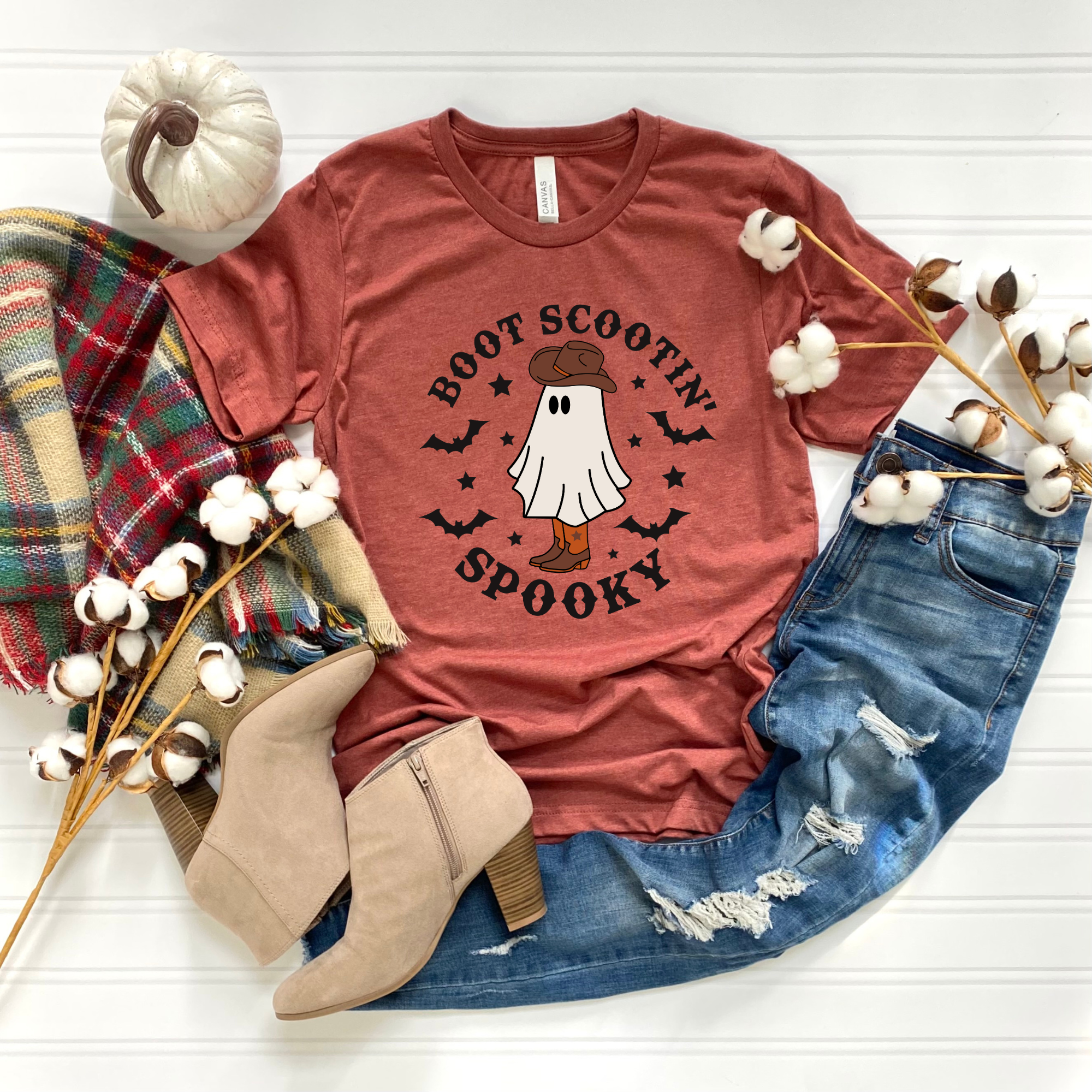 Boot Scootin' Spooky Tee with fall design, printed on Heather Clay color, Bella + Canvas fabric.