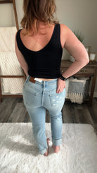 full back view of Sam Mid Rise Boyfriend Jeans with Distressed Finish and Star Patterned Pockets