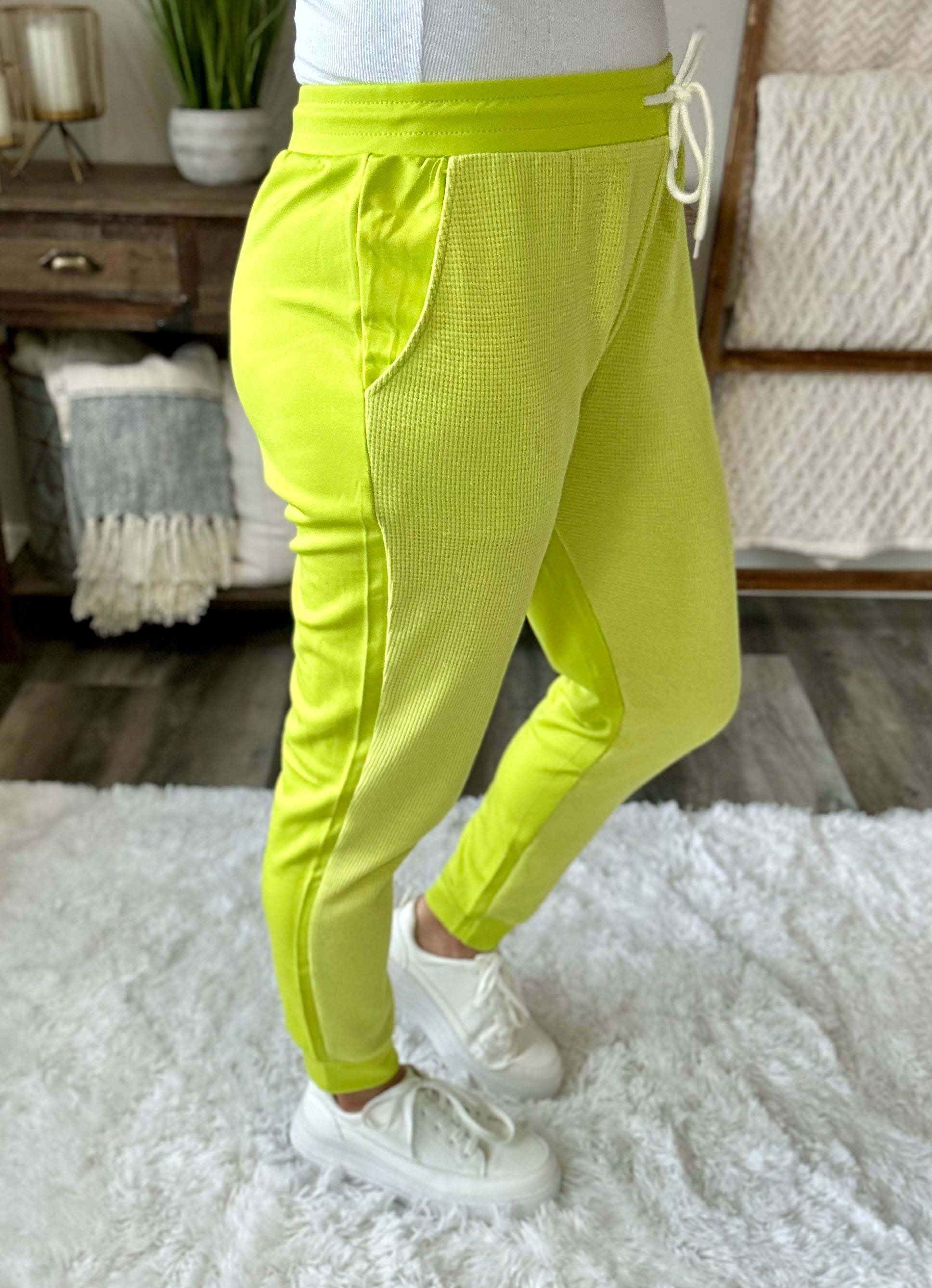 side view of Tommy Two Tone waffle joggers in Lime, contrast detailing, functional waist drawstring, side pockets, banded hemline, shown in various sizes
