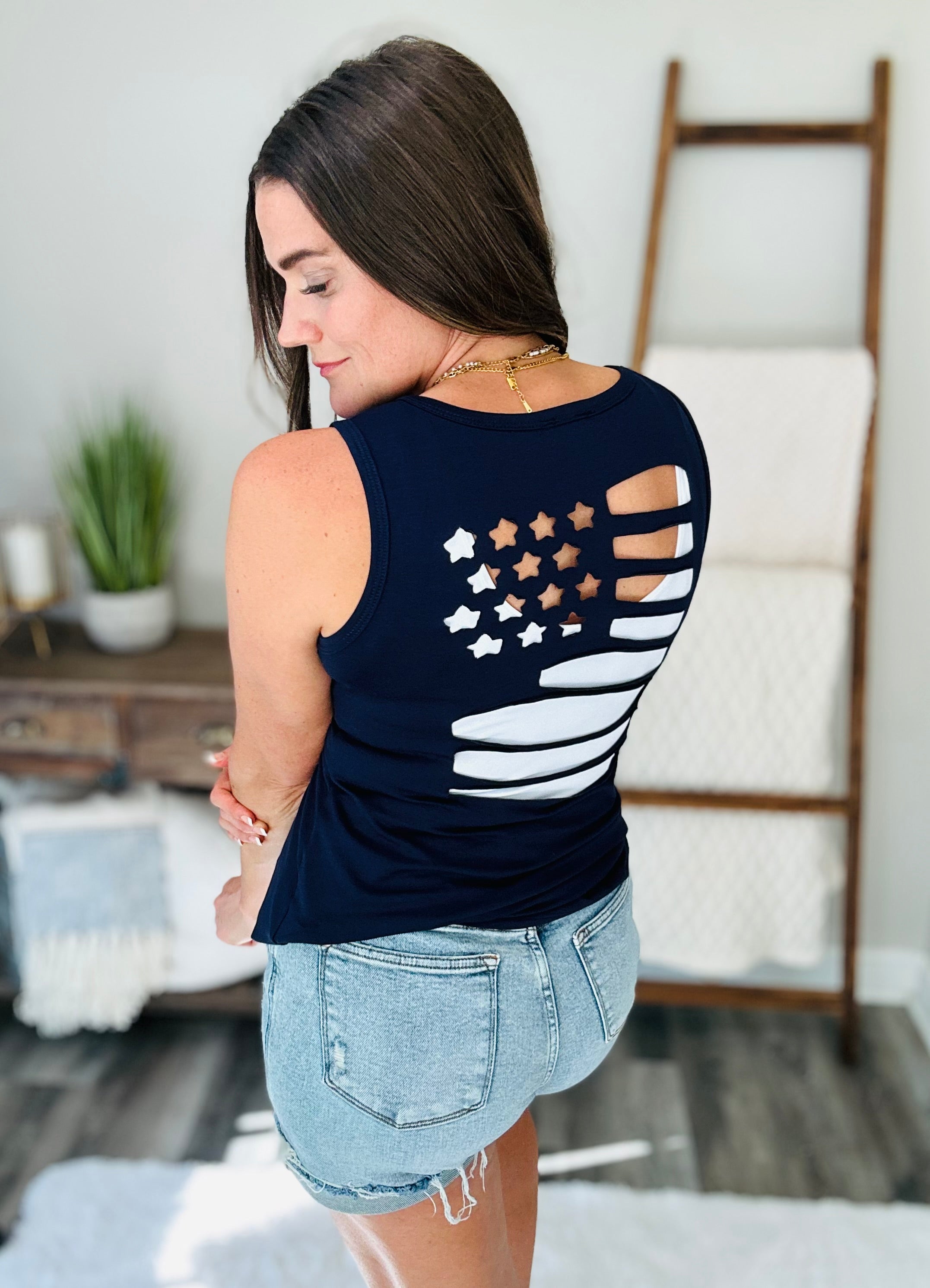 Land of the Free Tank in Navy with laser cut flag design, v-neckline, and sleeveless style.