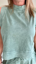 zoomed in detail of Chasing the Gains Tank Top in Olive with banded mock neckline, sleeve cuffs, and relaxed fit.