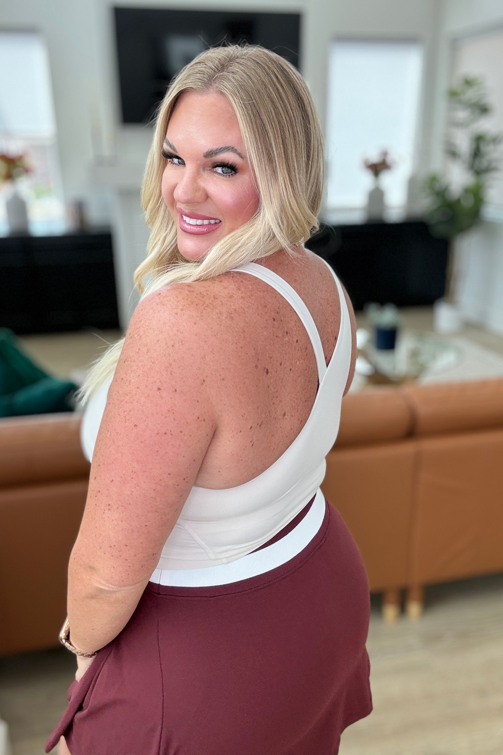 plus size side view of Doing it For Me Asymmetrical Tank in White Pearl, Cropped Tank with Built-in Sports Bra, Removable Cups, Contouring Seams, Soft Brushed Microfiber Tank