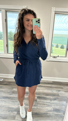 Getting Out long sleeve hoodie romper in navy, brushed microfiber, patch pockets, drawstring waist, shown in various size.