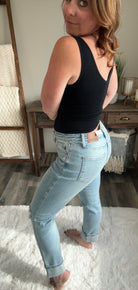 side view of Sam Mid Rise Boyfriend Jeans with Distressed Finish and Star Patterned Pockets