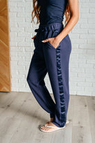 pocket detail of Lysa Satin Stripe Lounge Pants in Smoky Navy, high-rise, elastic waistband, satin tuxedo stripe, tapered leg, scuba knit fabric, shown in various sizes