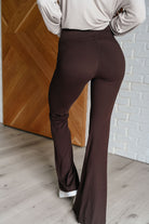 back view of Stamina Stride flare leggings in Espresso, high waist with coin pocket, front slit, brushed microfiber fabric, shown in various sizes