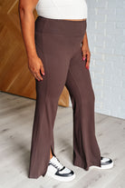 plus size slight side view of Stamina Stride flare leggings in Espresso, high waist with coin pocket, front slit, brushed microfiber fabric, shown in various sizes